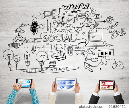 Top view of businesspeople sitting at table and using gadgets Top view of businesspeople sitting at table and using gadgets 61686451
