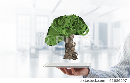 Eco green environment concept presented by tree as working mechanism or engine Eco green environment concept presented by tree as working mechanism or engine 61686997