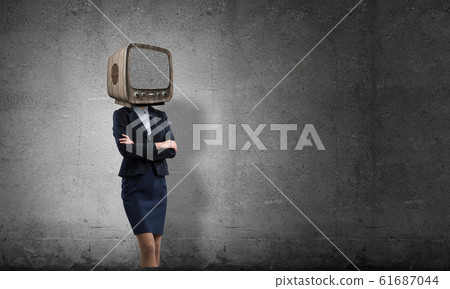 Business woman with old TV instead of head. Business woman with old TV instead of head. 61687044