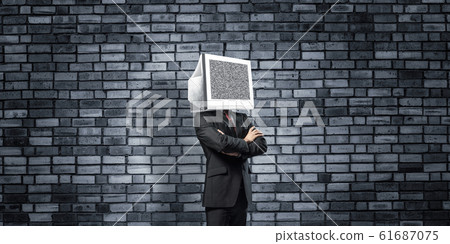Businessman with monitor instead of head. 61687075