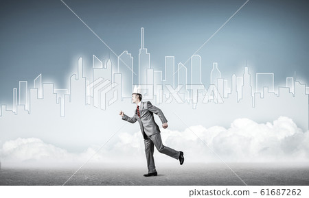 King businessman in elegant suit running and blue cityscape silh 61687262