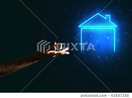Conceptual image with hand pointing at house or main page icon on dark background 61687288