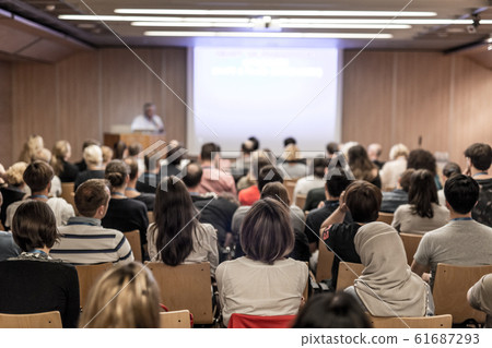 Business speaker giving a talk at business conference event. Business speaker giving a talk at business conference event. 61687293