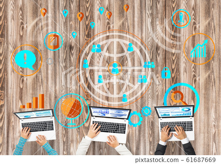 Top view of businesspeople sitting at table and using gadgets 61687669