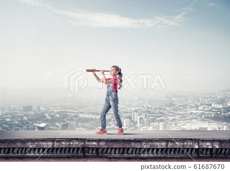 Concept of careless happy childhood with girl exploring this wor Concept of careless happy childhood with girl exploring this wor 61687670