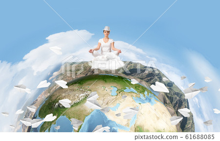 Young woman keeping mind conscious. Young woman keeping mind conscious. 61688085