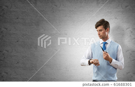 Conceptual image of young businessman. Conceptual image of young businessman. 61688301
