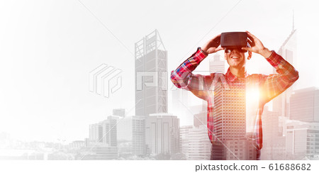 Guy wearing checked shirt and virtual mask demonstrating some emotions Guy wearing checked shirt and virtual mask demonstrating some emotions 61688682