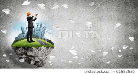 Confident boss and modern city as concept of eco green construction Confident boss and modern city as concept of eco green construction 61688686