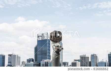 Business woman with old TV instead of head. Business woman with old TV instead of head. 61688862