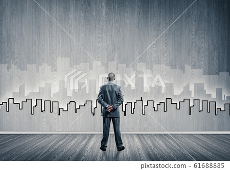 Silhouette of modern cityscape drawn on wall in room 61688885