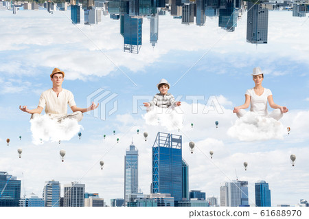 Young family keeping mind conscious. Young family keeping mind conscious. 61688970