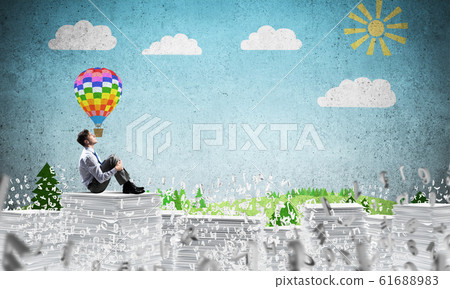 Businessman dreaming about future business. 61688983