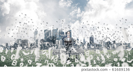Young businessman or student studying the science and symbols fl Young businessman or student studying the science and symbols fl 61689136