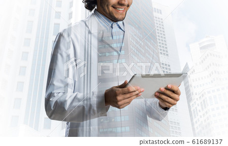 Medical industry concept by means of successful doctor Medical industry concept by means of successful doctor 61689137