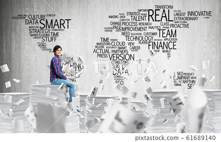 Attractive man sitting on pile of paper documents. Attractive man sitting on pile of paper documents. 61689140
