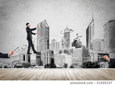 Business concept of risk support and assistance with man balancing on rope 61689197