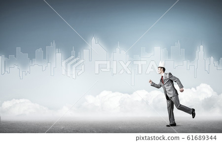 King businessman in elegant suit running and blue cityscape silh 61689344