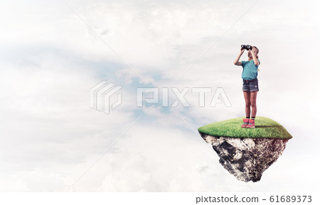 Concept of careless happy childhood with girl looking in binocul Concept of careless happy childhood with girl looking in binocul 61689373