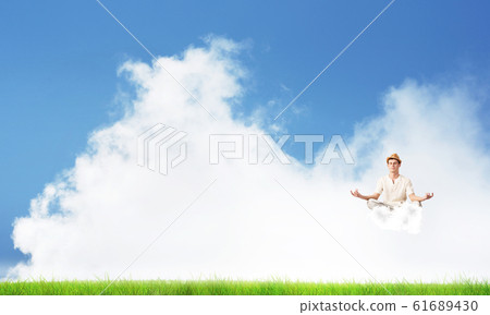 Young man keeping mind conscious. Young man keeping mind conscious. 61689430
