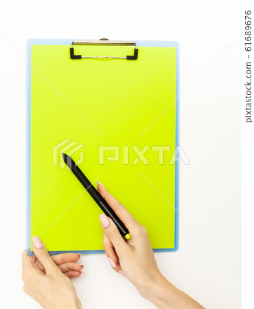 Blank Folder with Green Paper. Hand that Holding Folder and Pan Handle on White Background. Copyspace. Place for Text Blank Folder with Green Paper. Hand that Holding Folder and Pan Handle on White Background. Copyspace. Place for Text 61689676