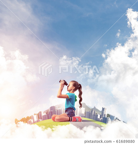 Concept of careless happy childhood with girl looking in future Concept of careless happy childhood with girl looking in future 61689880