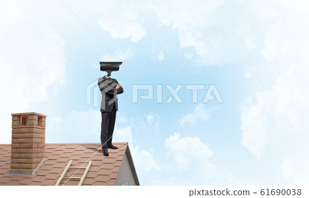 Concept of security and privacy protection with camera headed man Concept of security and privacy protection with camera headed man 61690038