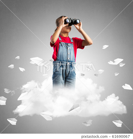 Concept of careless happy childhood with girl looking in binoculars Concept of careless happy childhood with girl looking in binoculars 61690067