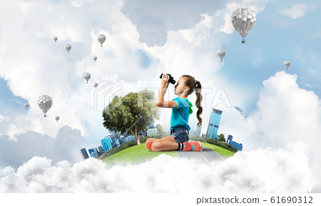 Concept of careless happy childhood with girl looking in future 61690312