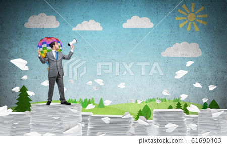 Businessman standing with megaphone. Businessman standing with megaphone. 61690403