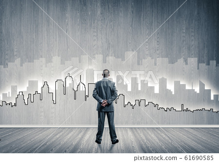 Silhouette of modern cityscape drawn on wall in room 61690585