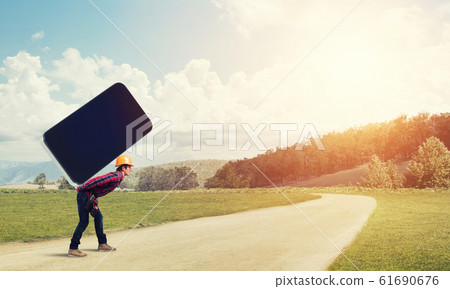 Builder man carry huge smartphone Builder man carry huge smartphone 61690676