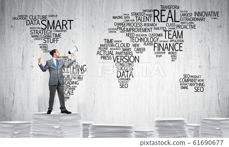 Businessman standing with megaphone. Businessman standing with megaphone. 61690677