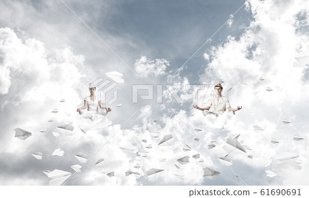 Young couple keeping mind conscious. Young couple keeping mind conscious. 61690691