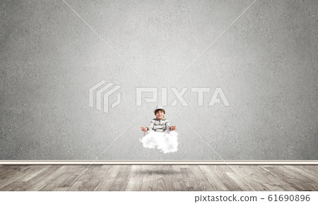 Young boy keeping mind conscious. Young boy keeping mind conscious. 61690896