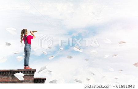 Concept of careless happy childhood with girl exploring this world Concept of careless happy childhood with girl exploring this world 61691048