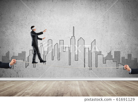 Business concept of risk support and assistance with man balancing on rope 61691129