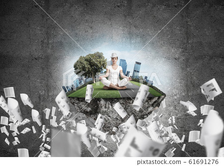 Young woman keeping mind conscious. 61691276