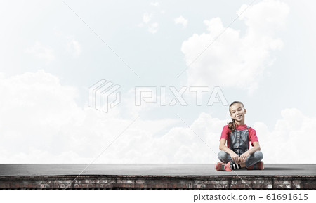 Concept of careless happy childhood with girl of school age smil 61691615