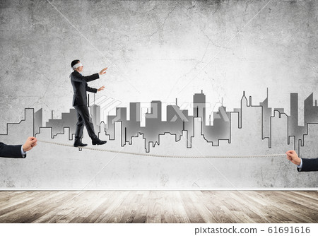 Business concept of risk support and assistance with man balancing on rope 61691616