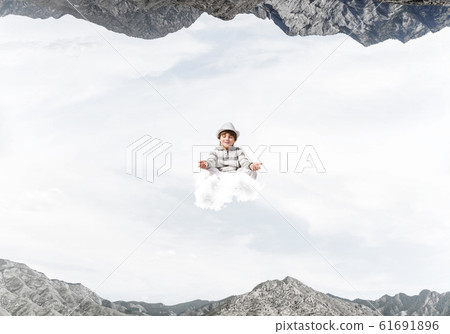 Young boy keeping mind conscious. 61691896