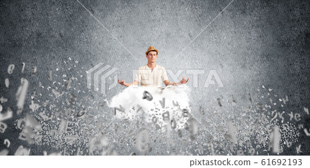 Young man keeping mind conscious. Young man keeping mind conscious. 61692193