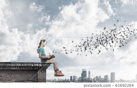 Concept of careless happy childhood with girl exploring this world Concept of careless happy childhood with girl exploring this world 61692264