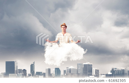 Young man keeping mind conscious. 61692305