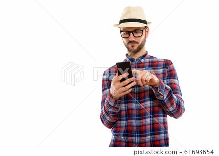 Young handsome bearded tourist man ready for vacation Young handsome bearded tourist man ready for vacation 61693654