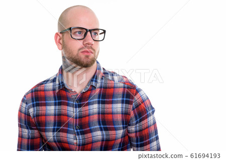 Studio shot of young bald muscular man Studio shot of young bald muscular man 61694193