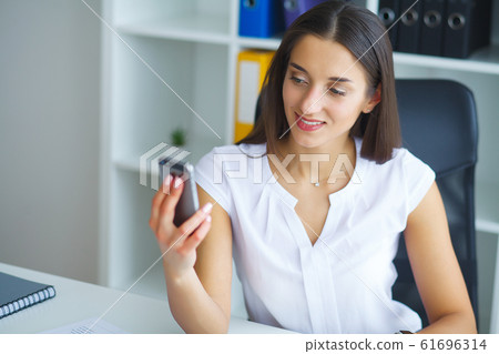 Portrait Of Businesswoman Working In Creative Office Portrait Of Businesswoman Working In Creative Office 61696314