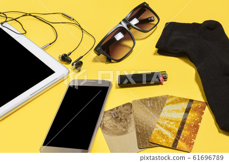 collection of modern people devices on a yellow background collection of modern people devices on a yellow background 61696789