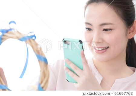 A woman shooting a summer lease A woman shooting a summer lease 61697768