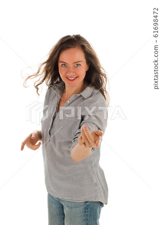 Pleased woman gesturing with finger 61698472